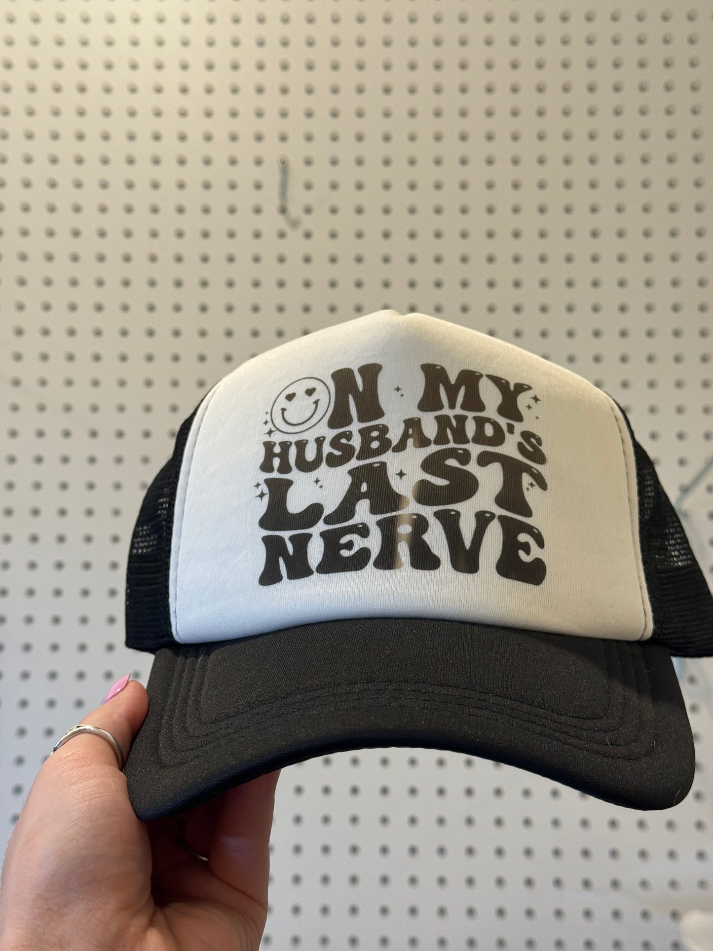 On my husband’s last nerve trucker hat - oops